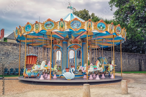 Colorful carousel in the city photo