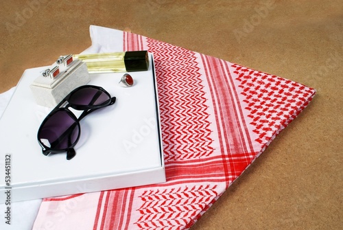 Saudi red shemagh headscarf with luxury accessories glasses perfume stone ring cuff links,Arabian photo