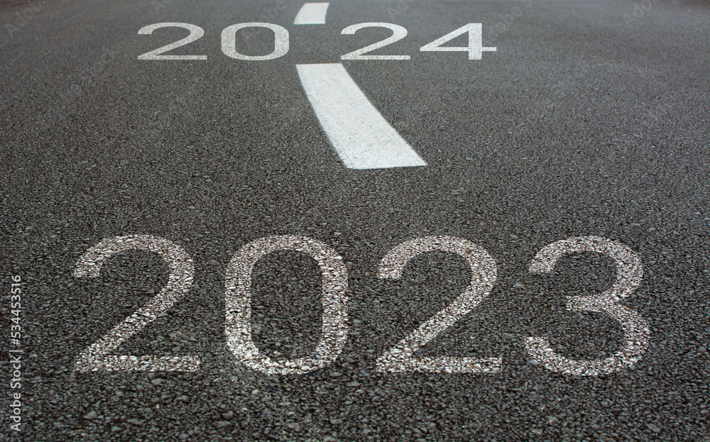 Years written on asphalt road.New year concept. Years written on asphalt road.New year concept.