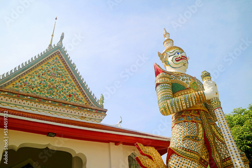 White Giant Sahatsadecha, One of Two Guardian Demons at the Eastern Gate of The Famous Temple of Dawn in Bangkok, Thailand photo