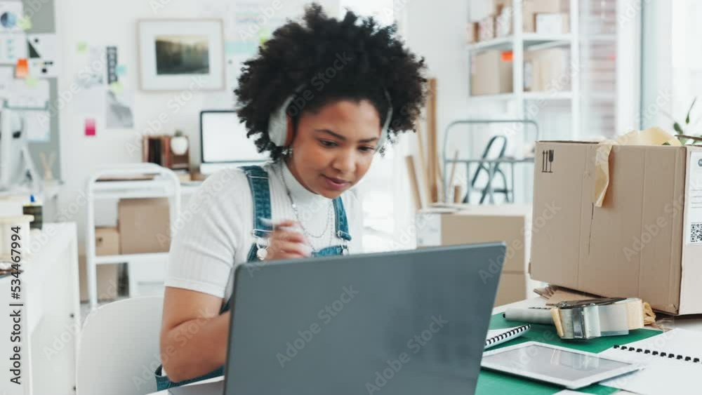 Black woman, laptop and notebook for ecommerce in office, home or studio to design. Woman, logistics and orders on website to help delivery online, with computer or pc at desk, for shipping product Black woman, laptop and notebook for ecommerce in office, home or studio to design. Woman, logistics and orders on website to help delivery online, with computer or pc at desk, for shipping product