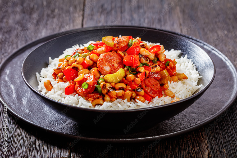Hoppin John with rice in black bowl, top view Hoppin John with rice in black bowl, top view