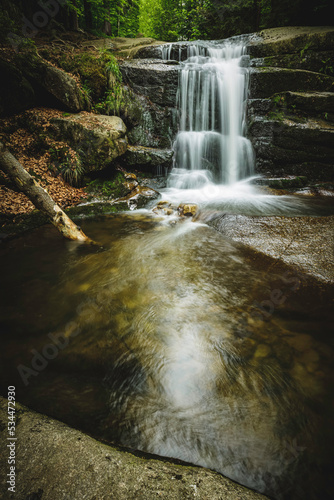 small waterfall in the mountain forest 