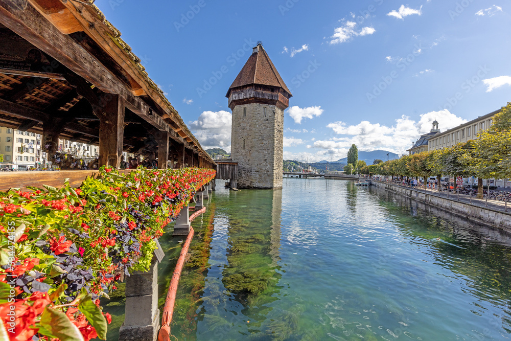 View along the flower-covered Chapel Bridge in Lucerne