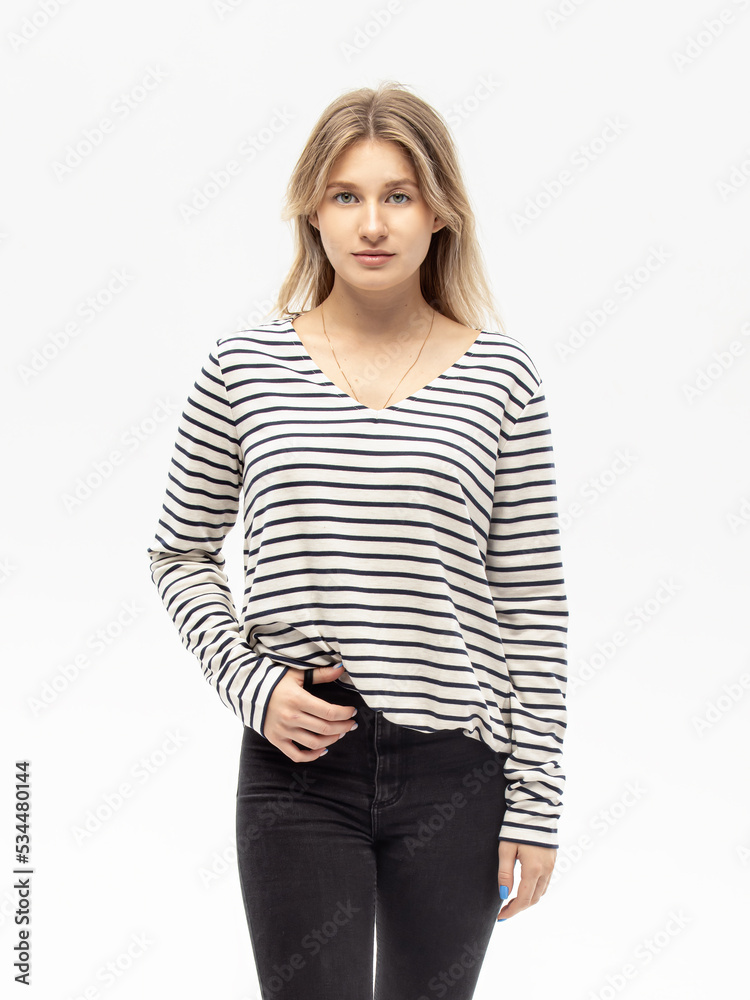 Striped sweater. Woman in lightweight casual oversize sweatshirt on white background. Black and white vest. Vertical Striped sweater. Woman in lightweight casual oversize sweatshirt on white background. Black and white vest. Vertical