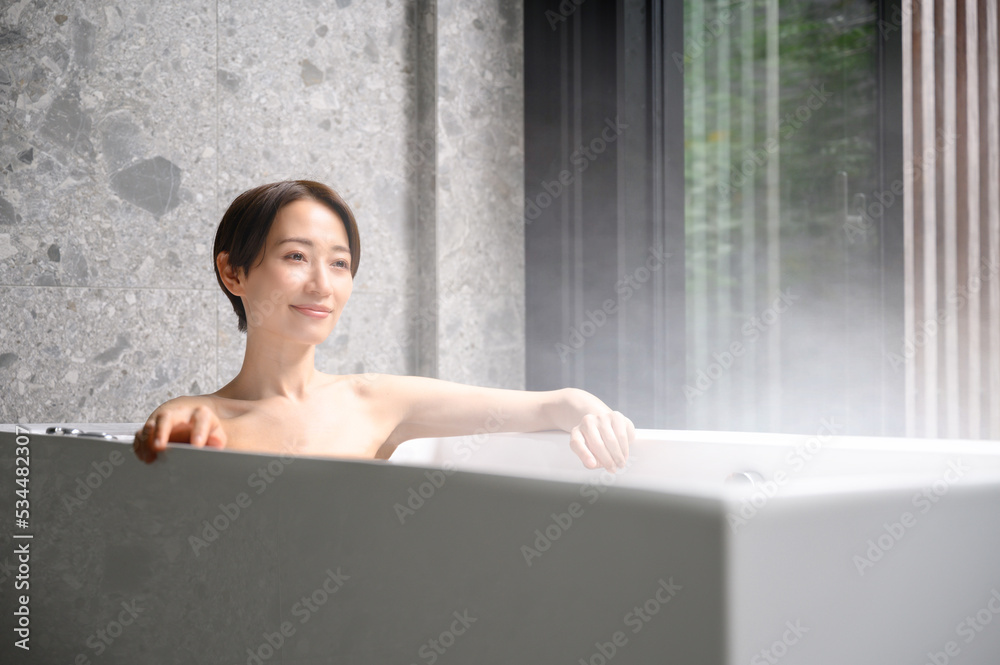 Woman relaxing in the bath tub Woman relaxing in the bath tub
