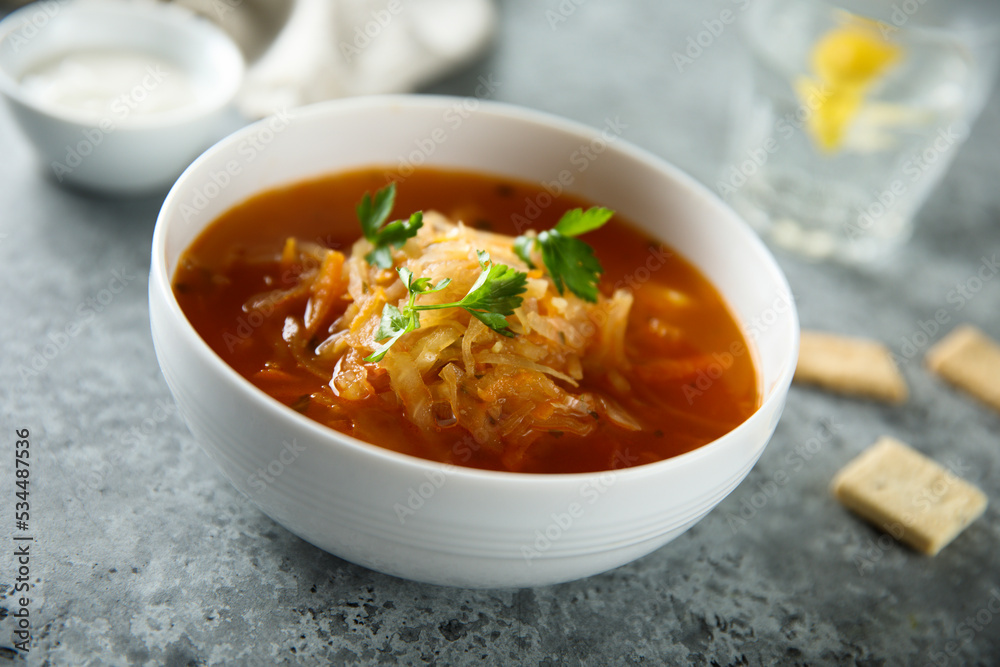 Traditional sauerkraut soup with fresh parsley Traditional sauerkraut soup with fresh parsley