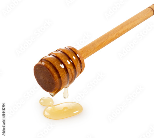 Honey and wooden honey dipper on white background.