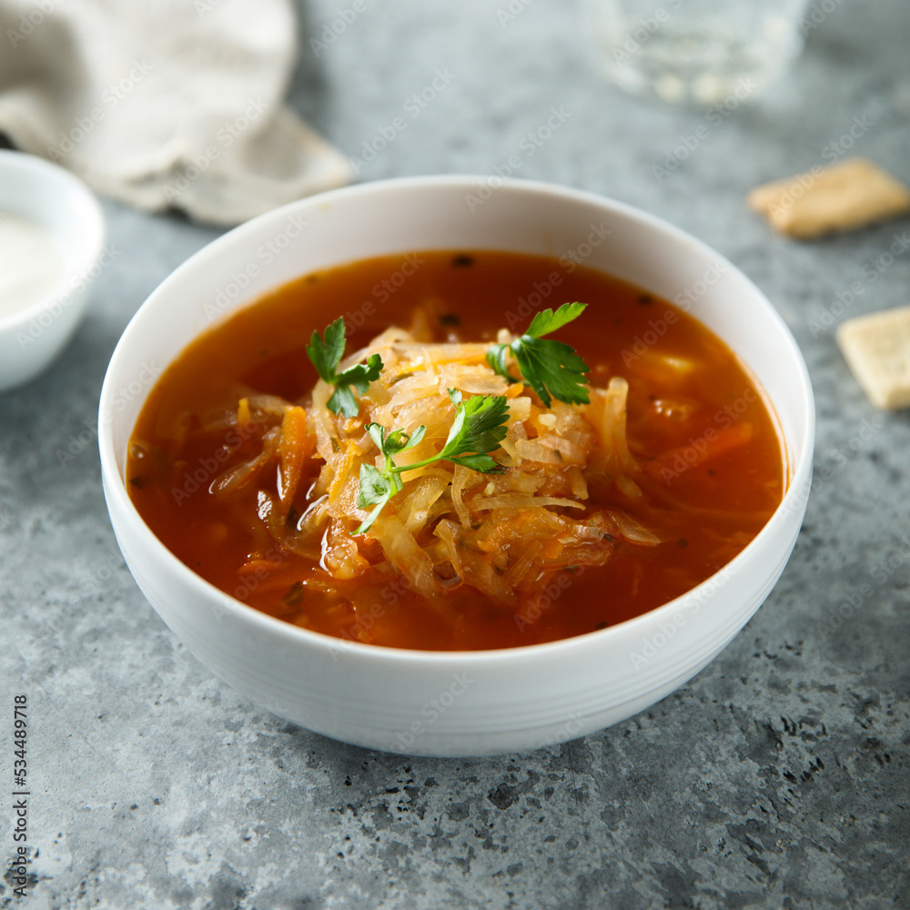 Traditional sauerkraut soup with fresh parsley Traditional sauerkraut soup with fresh parsley