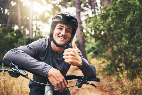 Fotografía Thumbs up man rider on mountain bicycle happy riding or training for fitness, wellness and health exercise outdoor