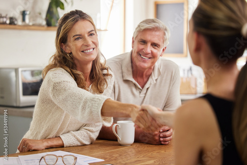 Handshake, life insurance and senior couple with lawyer for mortgage tax bills, property and financial investment. Finance, inheritance and old woman shaking hands with realtor for a successful deal photo