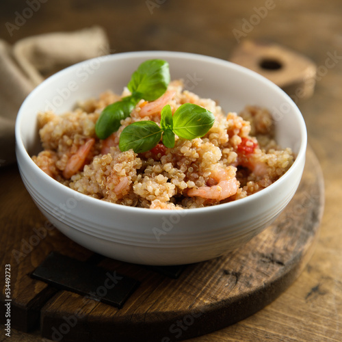 Healthy quinoa bowl with shrimps and basil