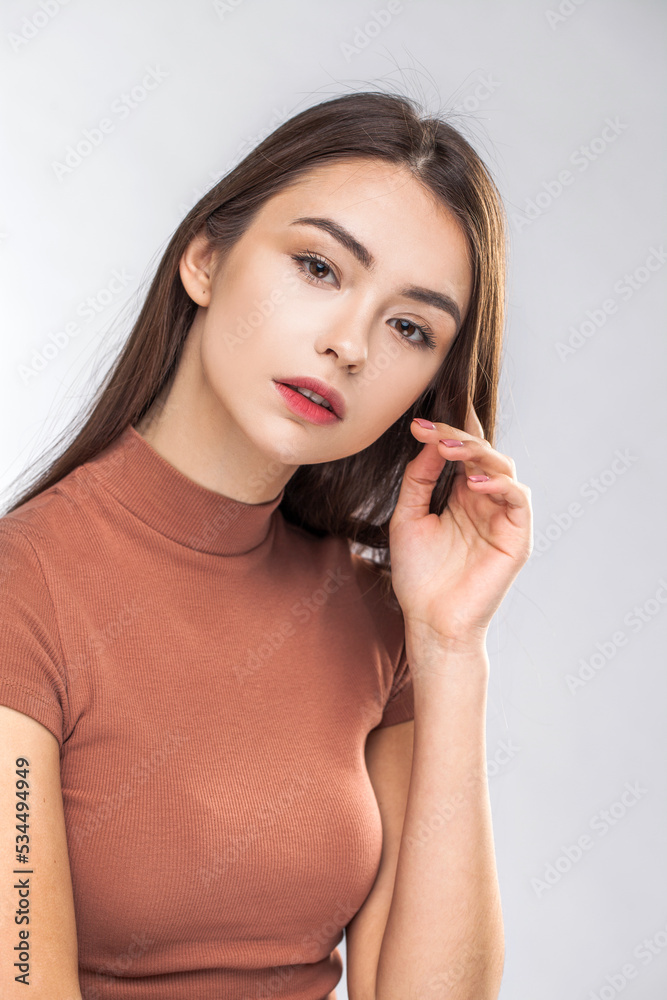 Portrait of a young beautiful brunette model, isolated on white background Portrait of a young beautiful brunette model, isolated on white background
