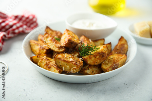 Roasted potato wedges with cheese and spices