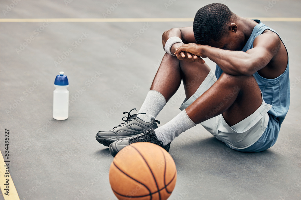 Tired, depression or sad basketball player with training gear after game  fail, mistake or problem. Depressed, mental health and anxiety or stress  sports, athlete teenager man frustrated with results Stock Photo