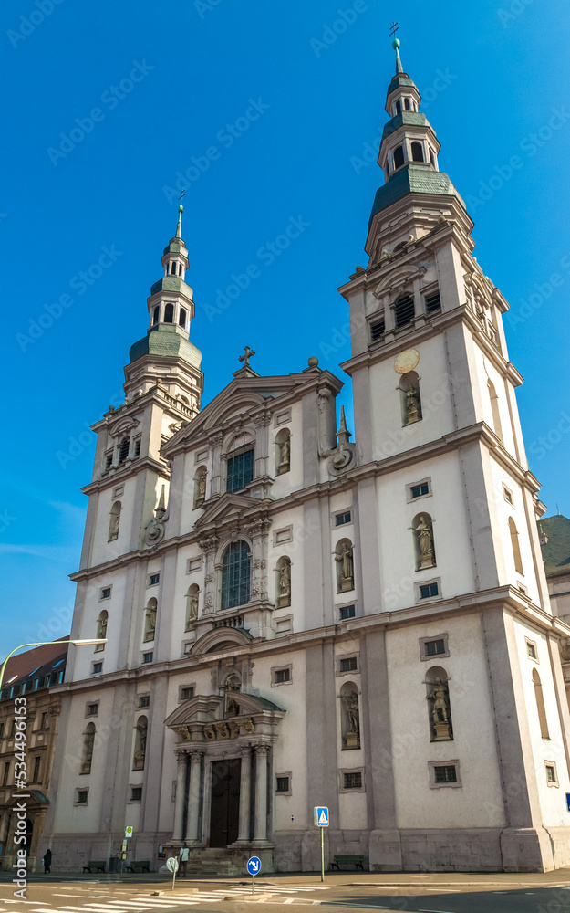 The front facade of the church Stift Haug in Würzburg, Germany. Above the portal is a figure of the church patron John the Baptist, in the other niches are the statues of the Fourteen Holy Helpers.