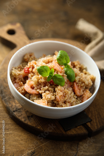 Healthy quinoa bowl with shrimps and basil