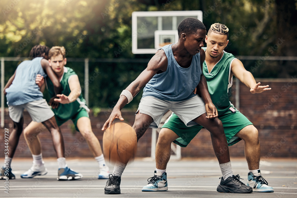 Sports, team and men playing basketball in a competition for college or university players with talent, skill and fitness. People in a competitive training match on an outdoor court using teamwork