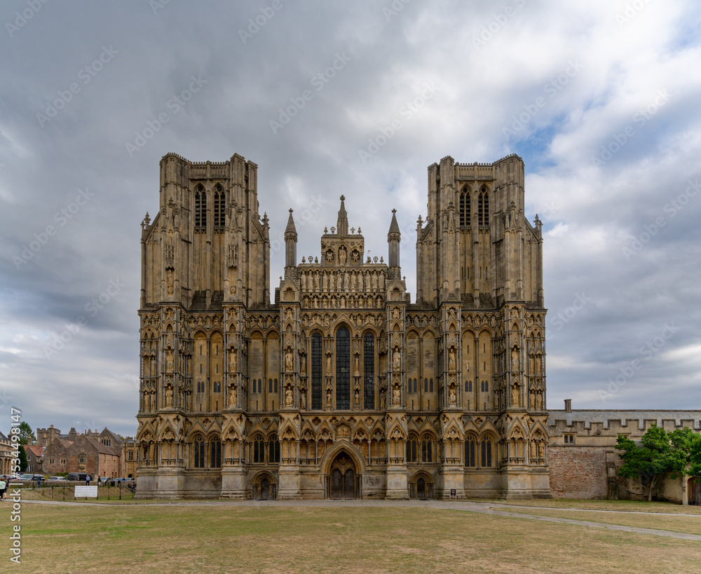 view of the two spires and front of the 12th-centruy Gothic Wells Cathedral in Somerset