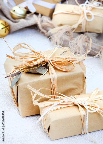 Rustic Christmas gifts, wrapped in recycled paper and twine with some botanical elements for an eco-friendly festive season