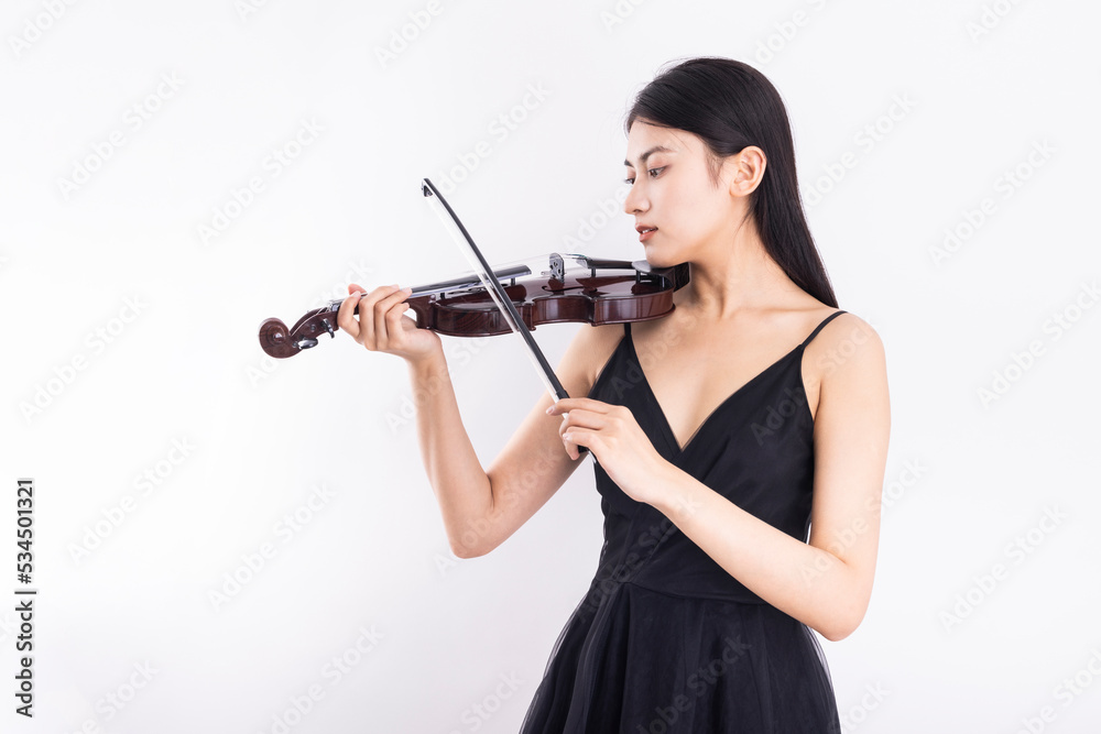 Young woman playing violin on white background Young woman playing violin on white background