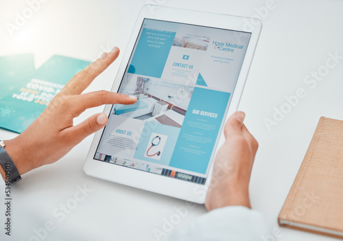 Hands, tablet and contact us with healthcare marketing or advertising on a website in the medical industry. Health, medicine and insurance with ux design on a wireless technology screen in a hospital