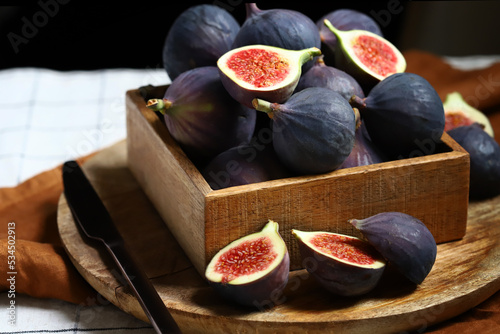 Fresh ripe figs in a wooden box.