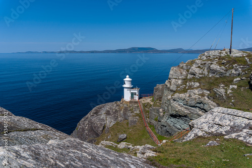 view of the historic Sheep's Head Lighthouse on the Muntervary Peninsula in County Cork of Ireland