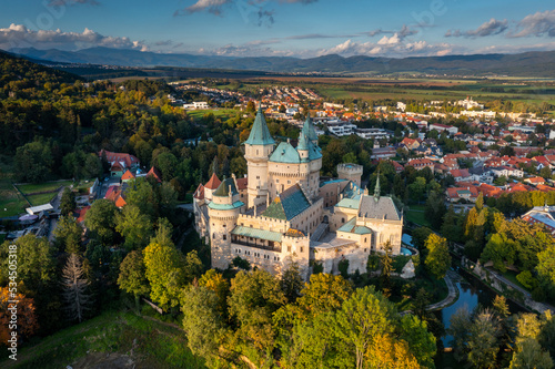 drone view of Bojnice Castle in Slovakia in warm evening light