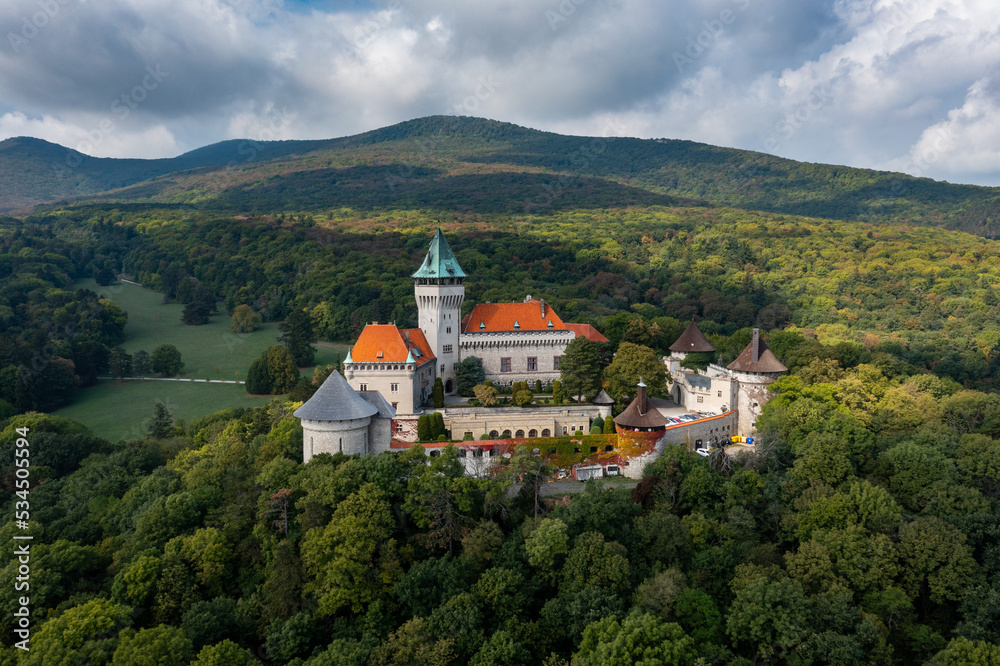 view of Smolenice Castle in the Little Carpathians in green late summer forest