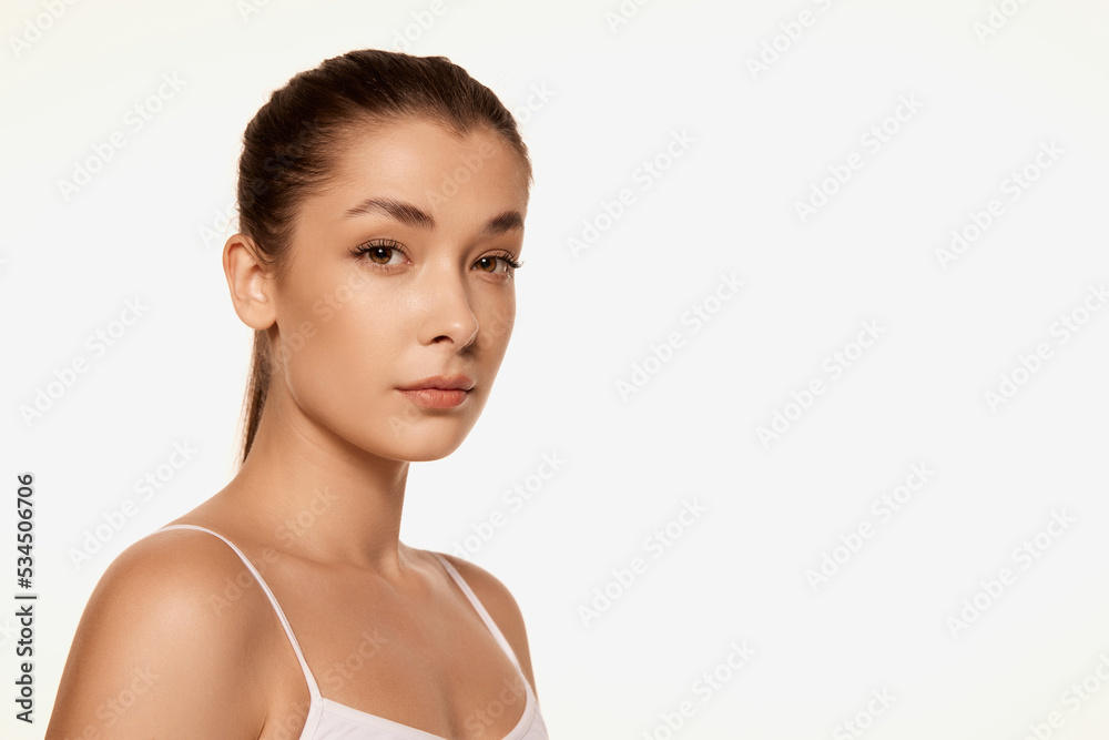 Portrait of young beautiful woman with clear spotless skin isolated over white background. Natural cosmetics face care Portrait of young beautiful woman with clear spotless skin isolated over white background. Natural cosmetics face care