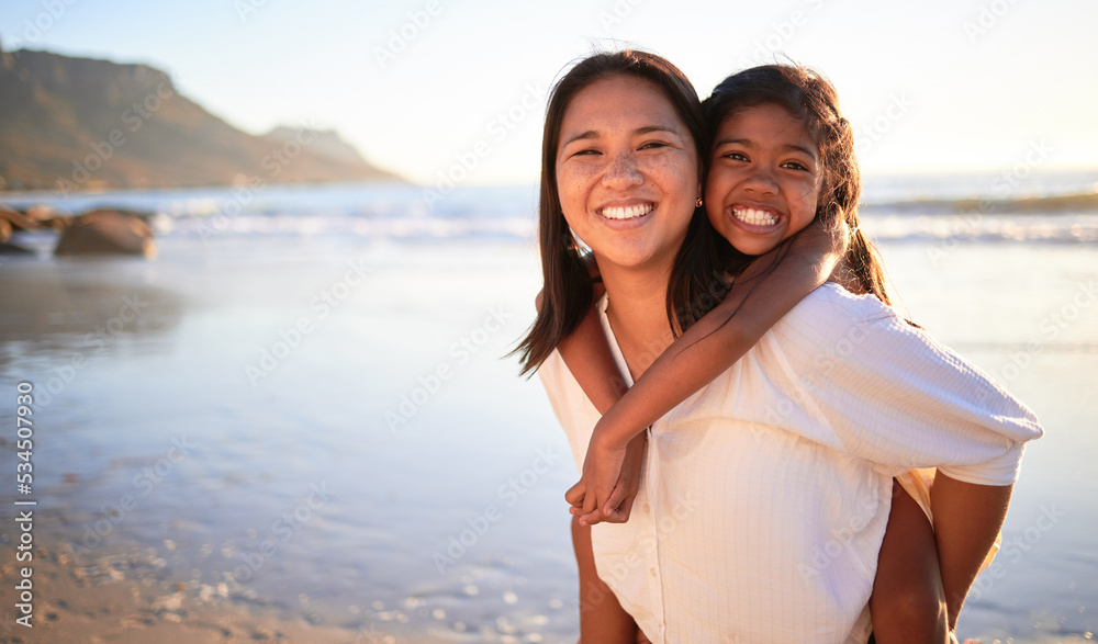 Happy mother and girl have fun together at the beach in the sun on summer vacation. Carefree woman carrying excited child while bonding outdoor. Single mom enjoy quality time with kid at the ocean Happy mother and girl have fun together at the beach in the sun on summer vacation. Carefree woman carrying excited child while bonding outdoor. Single mom enjoy quality time with kid at the ocean