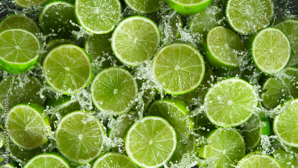 Freeze Motion Shot of Splashing Fresh Limes, Close-up.
