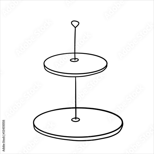 Two-tier serving tray for cupcakes. Plate with sweet dessert. Cupcake tableware