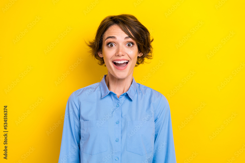 Photo of young excited funky pretty girlish lady bob brown hair unexpected sale offer wear formal blue shirt open mouth isolated on bright yellow color background Photo of young excited funky pretty girlish lady bob brown hair unexpected sale offer wear formal blue shirt open mouth isolated on bright yellow color background