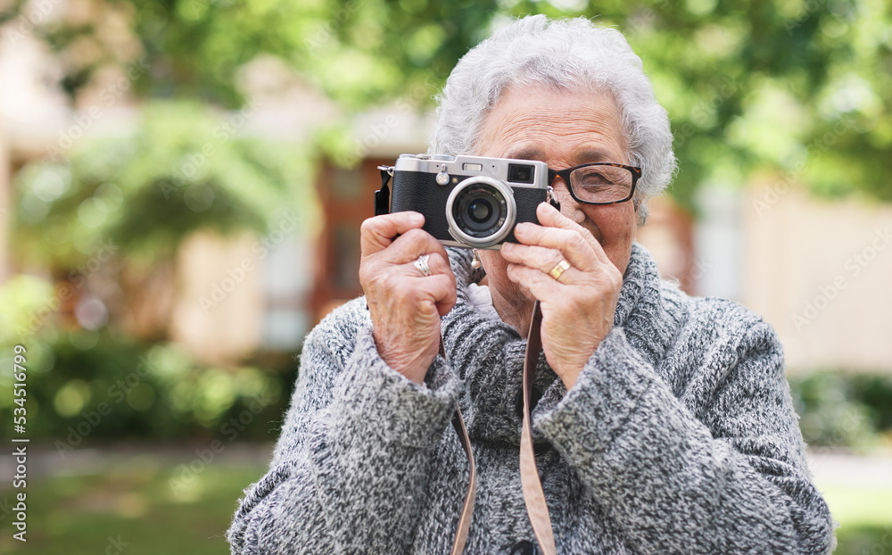 Retirement, relax and elderly woman with photographer hobby to enjoy pension leisure in garden. Satisfied, focused and senior lady with camera busy with nature photography outside nursing home. Retirement, relax and elderly woman with photographer hobby to enjoy pension leisure in garden. Satisfied, focused and senior lady with camera busy with nature photography outside nursing home.