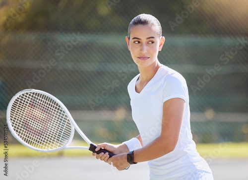 Tennis, sport and woman holding her racket and ready to play on court outdoor. Fitness and training female athlete playing in professional sports competition. Active female ready to serve in match © Jade M/peopleimages.com