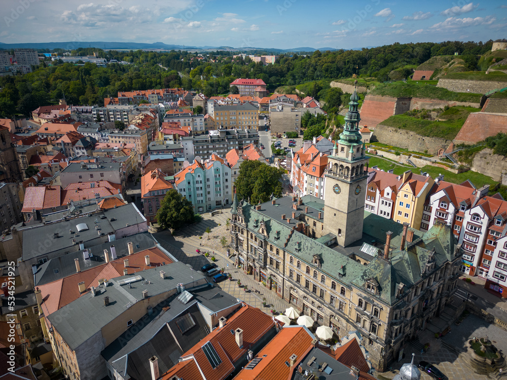 Kłodzko - a city situated in the mountains. Sunny day and clouds in the blue sky in the mountains.