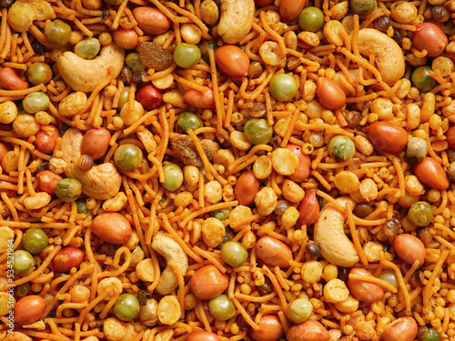 Bombay mixture - an Indian savoury snack made of gram flour-mixed with dry fruits and nuts.. photo