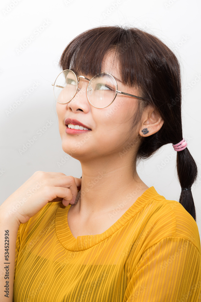 Portrait of beautifula asian smiling woman yellow shirt Portrait of beautifula asian smiling woman yellow shirt