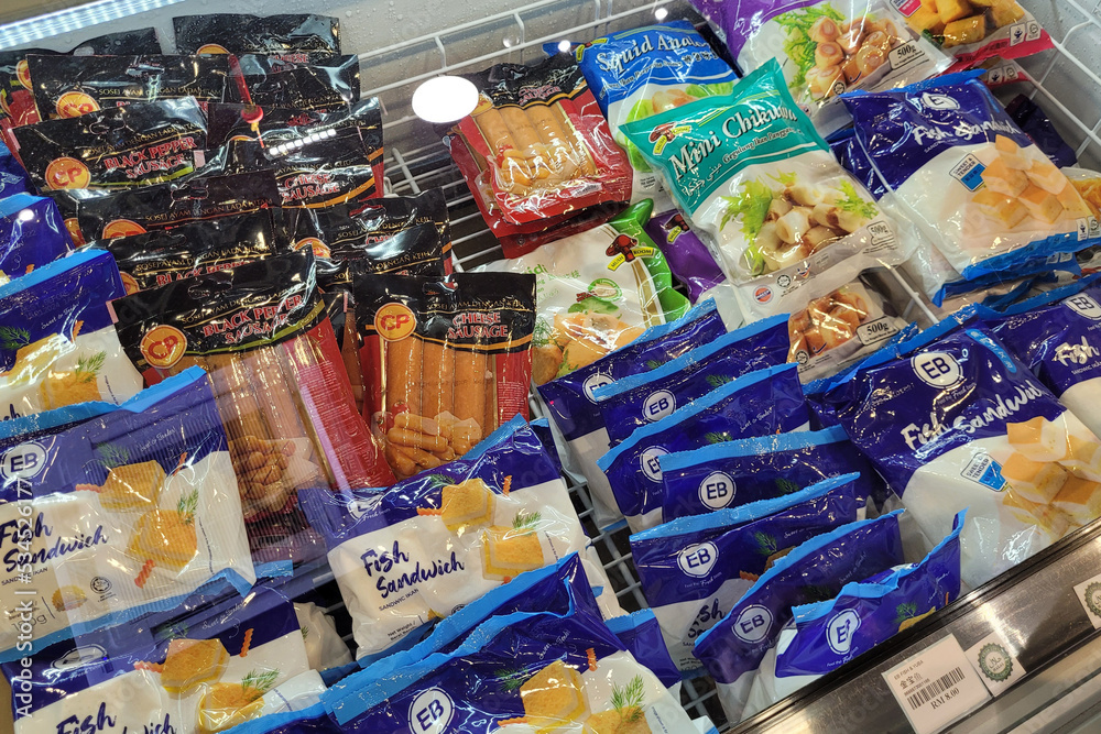 Penang, Malaysia 24 SEP 2022 Huge fridge with various choice frozen foods in a grocery store