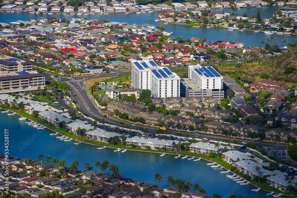 Upscale apartment buildings near a water canal in the Hawaii Kai residential neighborhood in the