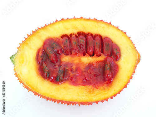 Gac fruit half on white background. Closeup photo, blurred. photo