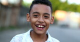 Happy hispanic latin south american child boy smiling