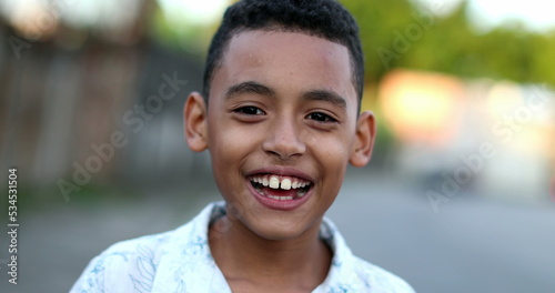 Happy hispanic latin south american child boy smiling