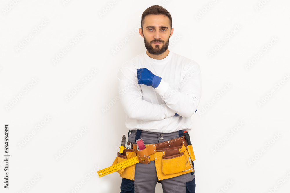 Man builder in a robe, overalls on a white background. Isolate, copy space