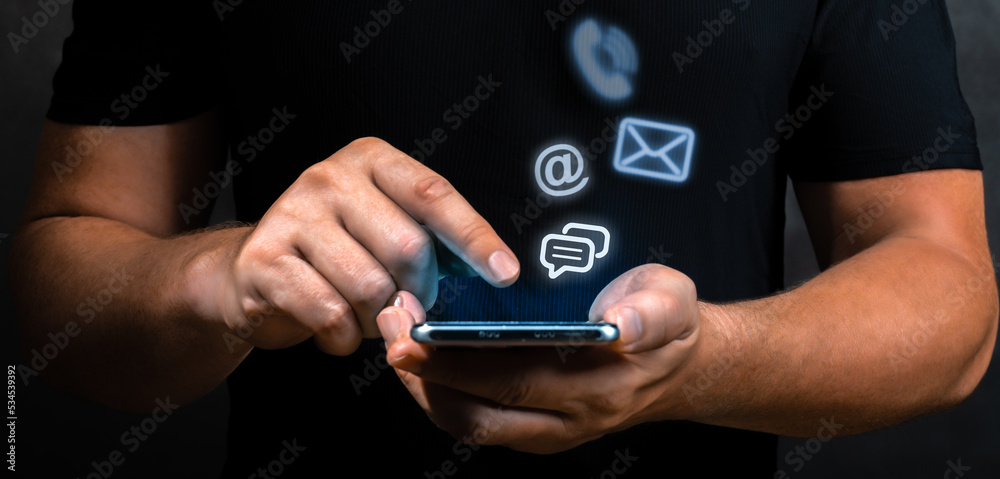 Contact Us, Hand of Businessman holding mobile phone with mail,phone ...