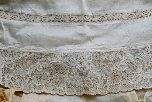 Antique lace family heirloom christening gown - 1930. Close up of the lace hem and delicate material.