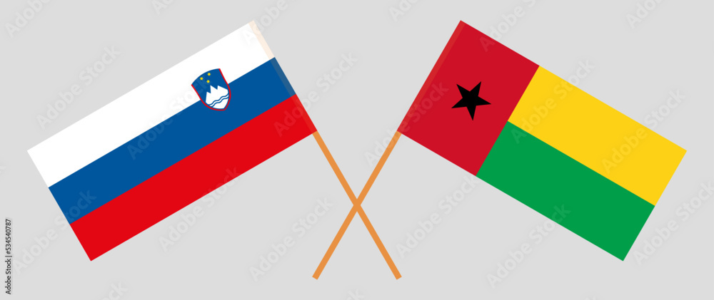 Crossed flags of Slovenia and Guinea-Bissau. Official colors. Correct proportion Crossed flags of Slovenia and Guinea-Bissau. Official colors. Correct proportion