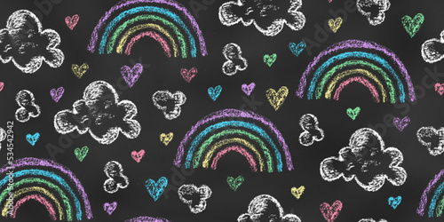 Seamless Pattern of Chalk Drawn Sketches Rainbows, Clouds, Hearts on Chalkboard Backdrop. Stylized Grunge Endless Motif.